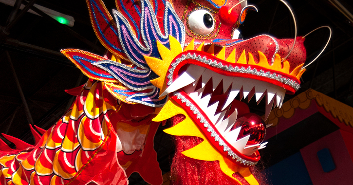 Bright red Chinese dragon dance costume inside Durham University's Oriental Museum